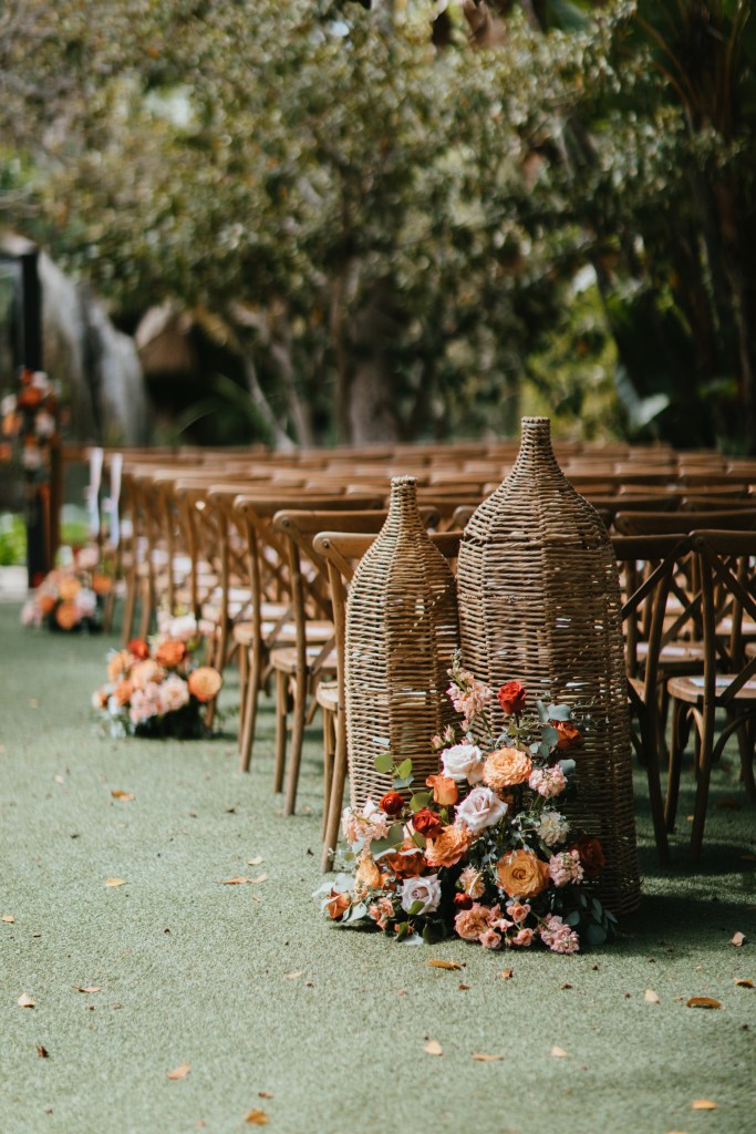 garden ceremony aisle floral arrangements